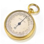 An early 20th century gilt metal cased miniature aneroid barometer, with silvered dial, diameter