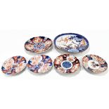 A late 19th century Japanese Imari dish, decorated with a garden scene and peonies, with gilt