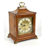 MAPPIN & WEBB; a mid 20th century walnut cased bracket clock, the brass face with applied mask heads