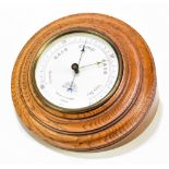 NEGRETTI & ZAMBRA; a brass cased aneroid barometer, the circular dial no.14,291, diameter 12cm,