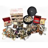 A large quantity of assorted costume jewellery including various necklaces, beads, etc.