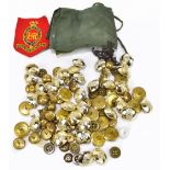 A collection of assorted military buttons, cap badge, including an example for the Royal Artillery