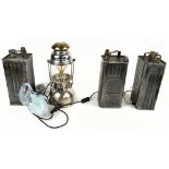 A set of three jerry can lamps, together with a electroplated oil lamp, height of largest 42cm.