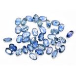 SAPPHIRE; a group of oval facet cut stones weighing 22.66ct, each 6mm x 4mm.