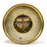 PERTUIS, HULOT & NAUDET; a brass plated cased aneroid barometer with silvered dial, diameter 21cm.