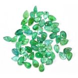 EMERALDS; a group of pear shaped facet cut stones weighing 20ct, each 6mm x 4mm.