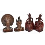 A pair of 20th century Thai carved redwood bookends modelled as a goddess, height 30cm, with an