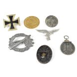 A small collection of Third Reich badges.