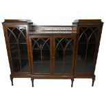 An early 20th century mahogany display cabinet, with four glazed doors, on tapered legs, height