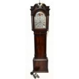 A George III mahogany longcase clock, the broken swan neck pediment above arched silvered dial set