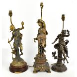 A brass figural table lamp modelled as a maiden standing upon a circular base, height 64cm, with two