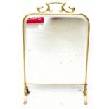 An Art Nouveau brass framed fire screen with bevelled mirror plate, height 67cm.