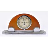 LENNIE OF EDINBURGH; an Art Deco chrome mounted table aneroid barometer with amber coloured body,
