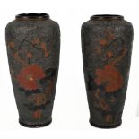 A pair of Japanese Meiji period hand painted vases of shouldered form with floral decoration in