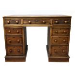A Victorian mahogany pedestal desk, with an arrangement of nine drawers, on plinth base, height