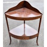 An early 19th century mahogany corner washstand.