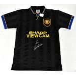 ERIC CANTONA; a Manchester United 'Kung Fu Kick' shirt, signed to the front, size S.Additional