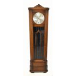 An early 20th century oak cased longcase clock, the silvered dial set with Arabic numerals and