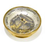 A brass plated cased aneroid barometer with glass dial, diameter 16.5cm.