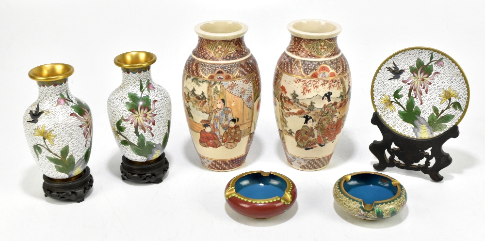 A pair of Japanese Satsuma vases, decorated with figures in gardens, height 18cm, with a pair of