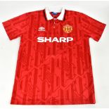 ERIC CANTONA; a 1992/94 Manchester United home shirt, signed to the reverse, size M.Additional
