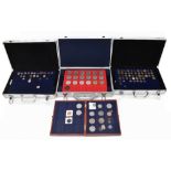 A large collection of coins, housed in three metal cases and a box, including commemorative