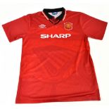 ERIC CANTONA; a Manchester United 1994/96 home shirt, signed to the reverse, size unknown.Additional