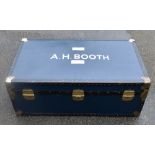 A mid century studded travelling trunk, with printed name 'A.M. Booth'.