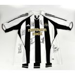 NEWCASTLE UNITED; a home shirt, signed to the front by Keegan, Ferdinand, McDonald, Shearer, Robson,