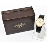 LONGINES; a gentleman's 1970s 9ct yellow gold wristwatch with gold batons to the circular dial and