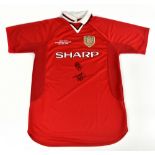 MANCHESTER UNITED; a 1999 Camp Nou retro style shirt, signed to the front by Solskjaer and