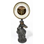 An early 20th century figural aneroid barometer with detachable circular cased aneroid barometer,