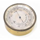 An early 20th century gilt metal cased aneroid pocket barometer with silvered dial, diameter 5.