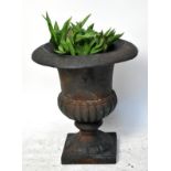 A cast iron Campana style urn.