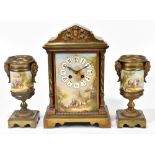 A late 19th century gilt metal and enamel painted clock garniture, the clock with rectangular dial