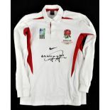 JONNY WILKINSON; a 2003 World Cup winners' rugby embroidered shirt, signed to the front, size M.