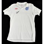 DAVID BECKHAM; a 2010 England football shirt, signed to the front, size L. Additional