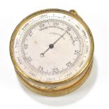 An early 20th century gilt metal cased combination pocket aneroid barometer and compass, with