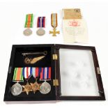 A group of various WWII medals including a British Defence Medal, France Medal and a WWII War