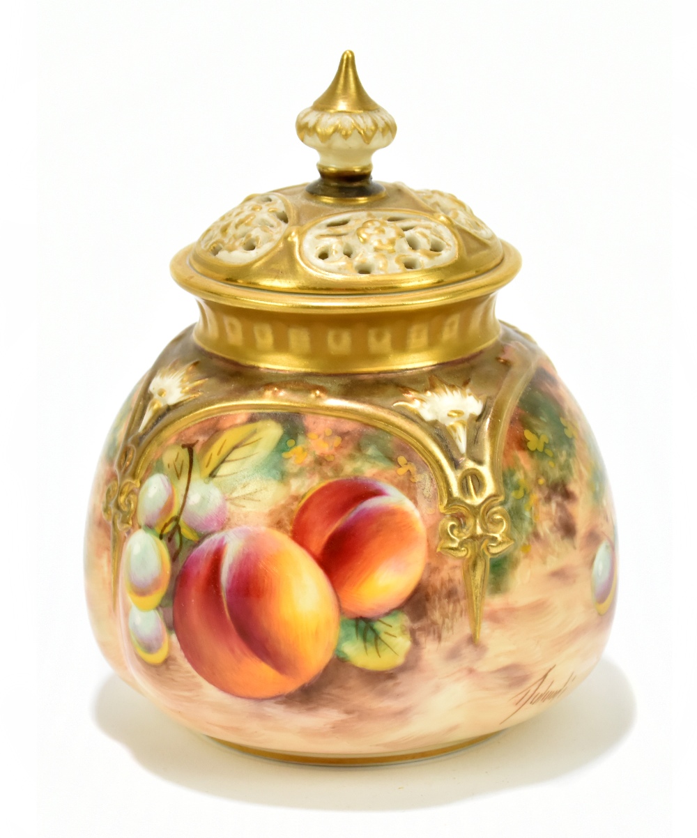 T HOLLAND FOR ROYAL WORCESTER; a hand painted potpourri and cover decorated with fruit in panels,