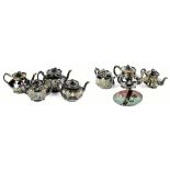 Four Jackfield type teapots, each with floral decoration with green highlights, with a further three