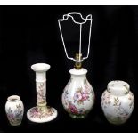 MOORCROFT; four Spring Blossom pattern items comprising an ovoid lamp, height 25cm, a candlestick, a