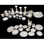 A large quantity of modern cream ware including candlesticks, basket, teapot, jugs, etc.