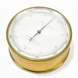 NEGRETTI & ZAMBRA OF LONDON; a compensated aneroid barometer with silvered dial, diameter 12cm.