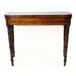 An early 19th century mahogany card table, on turned legs, height 74cm, width 90cm, depth 42cm.