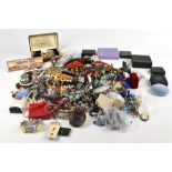 A large quantity of costume jewellery including beads, bracelets, necklaces and rings.