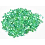 EMERALDS; a group of round facet cut stones weighing 20ct, each 2.5mm.