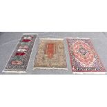 An Eastern style runner with stylised panels inside floral detail, approx 186 x 63cm, bears