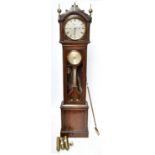 An early 19th century Irish mahogany and brass inlaid chiming longcase clock, the shaped pediment