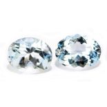 AQUAMARINE; a pair of oval facet cut stones weighing 4.40ct, measuring 10mm x 8mm.